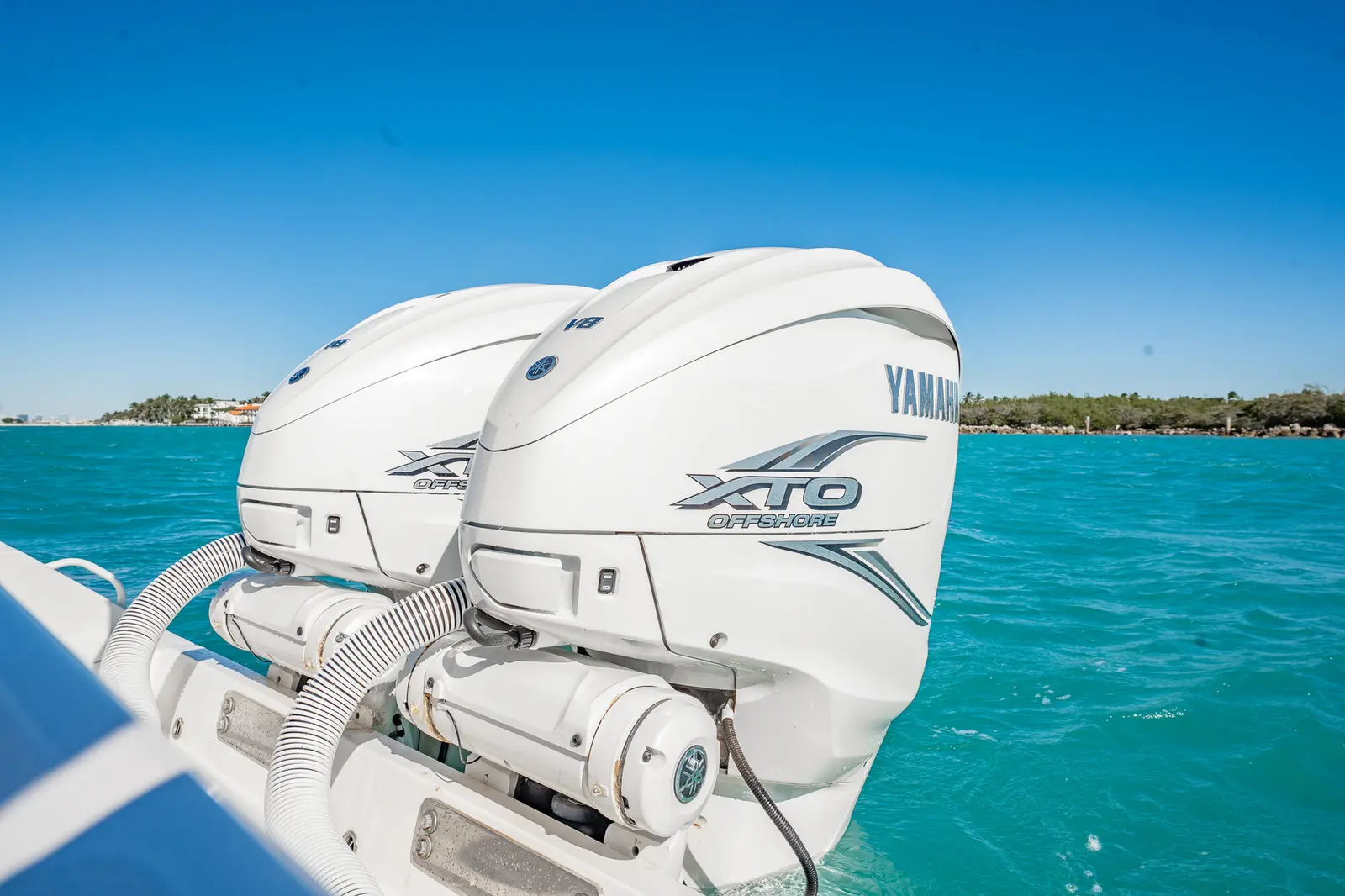 Twin Yamaha 425 engines with the Miami skyline in the distance