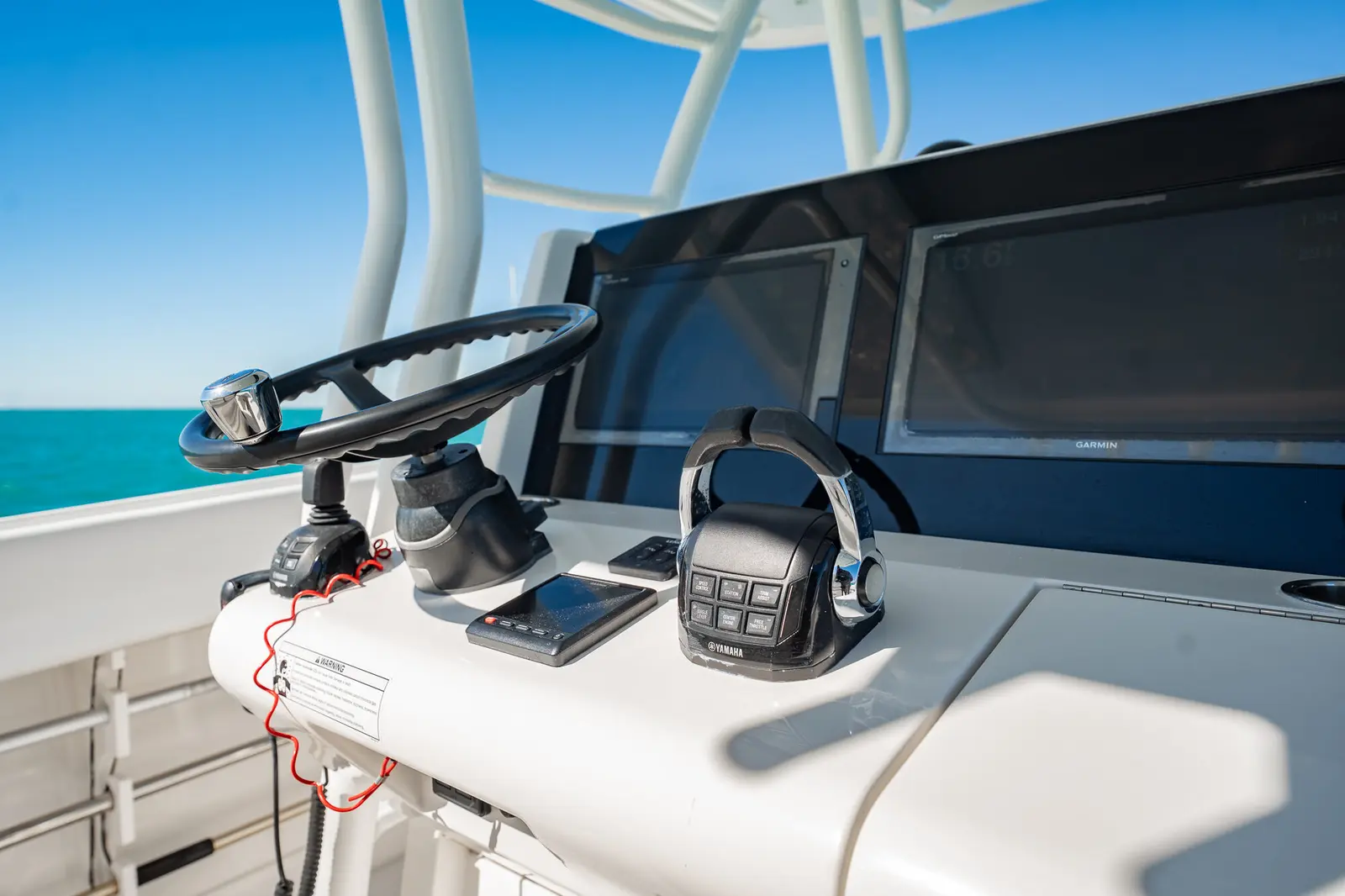 Garmin 8617 displays and Yamaha Helm Master joystick at the upper helm station