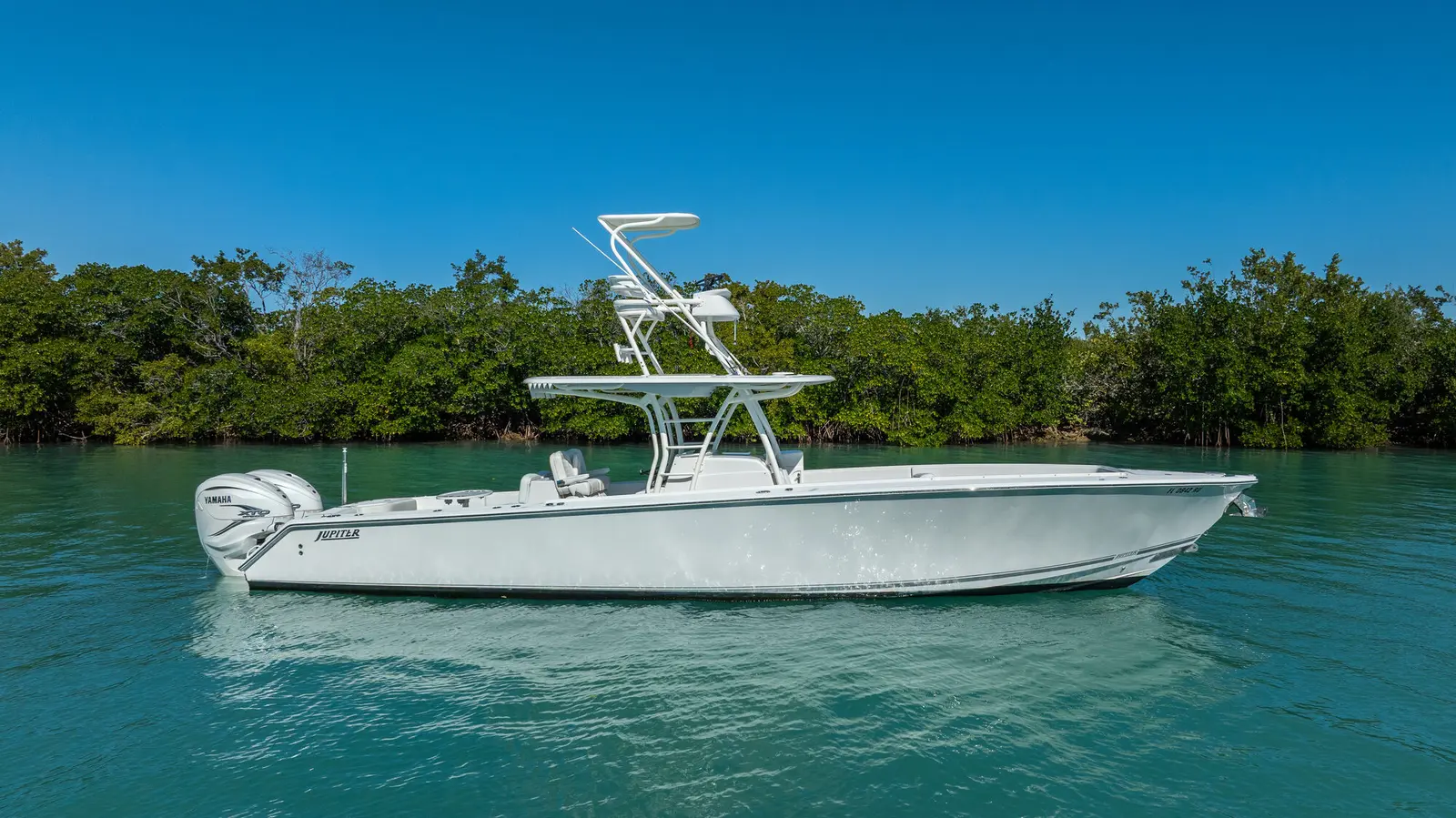 Side profile of the Jupiter 38 HFS at anchor, showing the full Marlin Tower and second helm